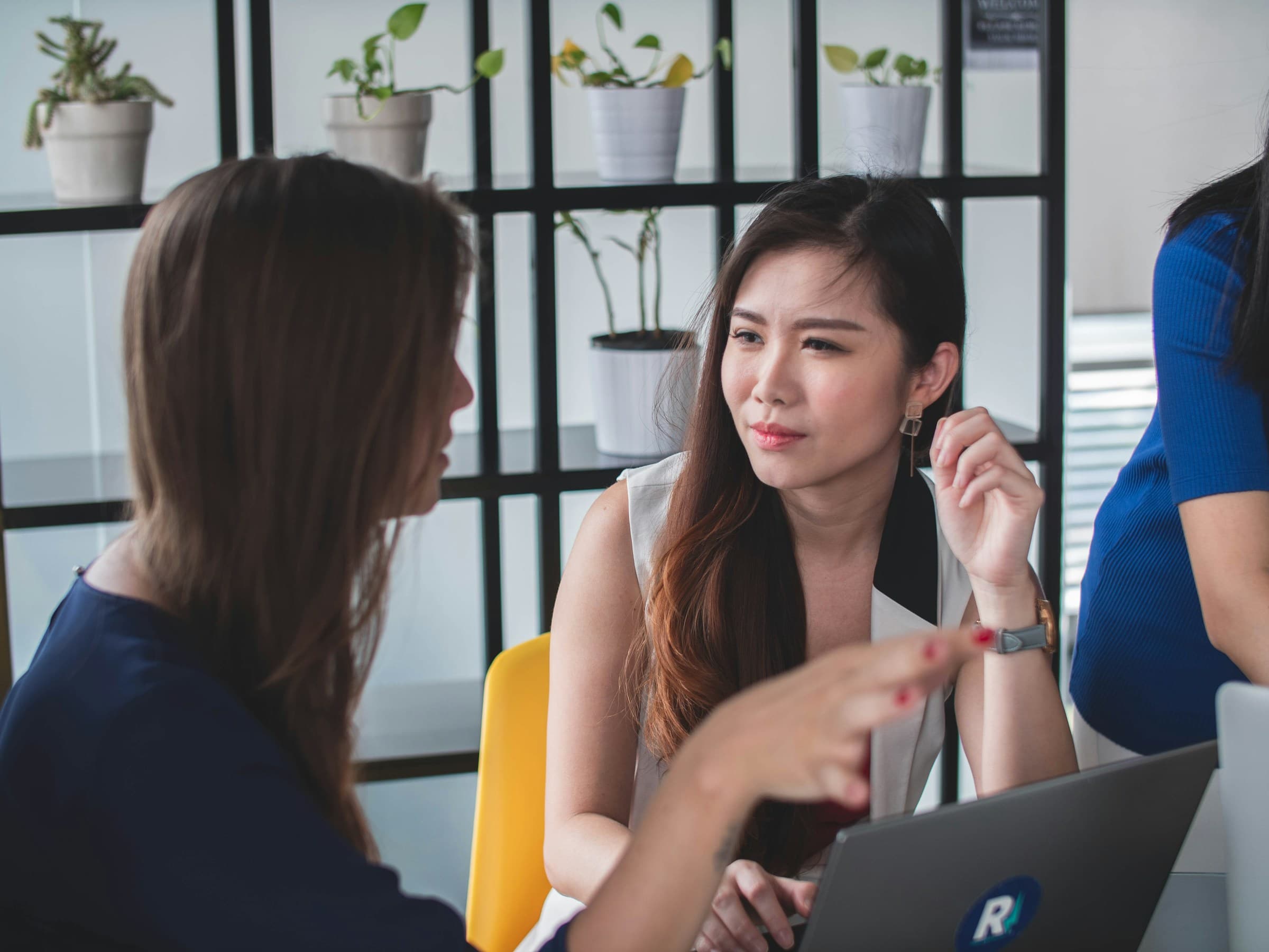 Manager coaching an employee on AI skill development